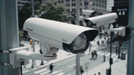 surveillance system monitoring urban activity with multiple cameras capturing pedestrians in a busy city intersection overhead view