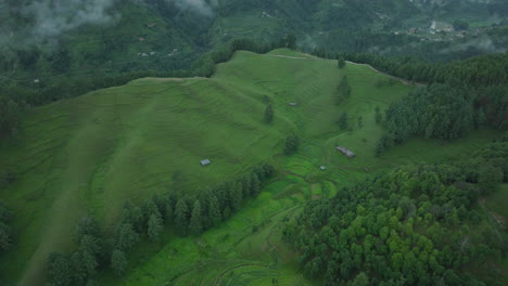 Drone-shot-of-green-lush-valley-in-Makwanpur,-Nepal,-a-popular-tourist-destination