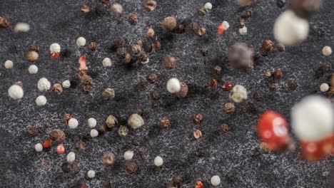 mixed peppercorns falling