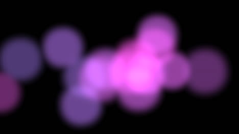 Blurred-pink-circles-that-slowly-move-hypnotically-on-black-background