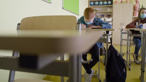 tracking video of students writing during a pandemic.