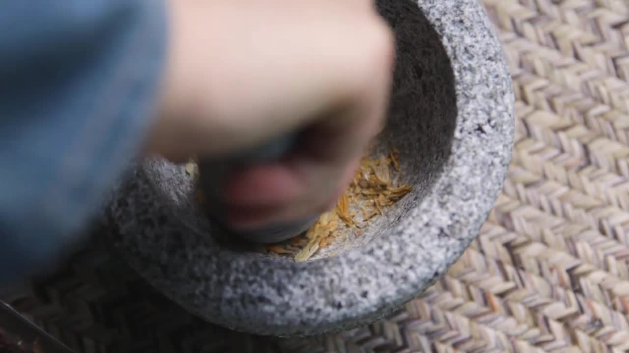 Grinding Spices in a Mortar and Pestle