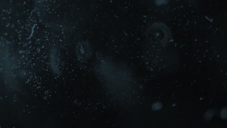 animation of white moving spots on black background