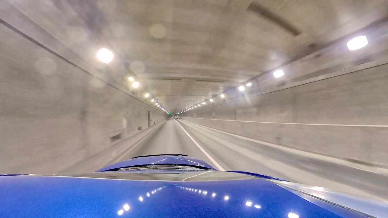 Vehicle entering tunnel under the canal.