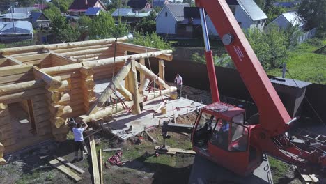 log cabin construction with crane