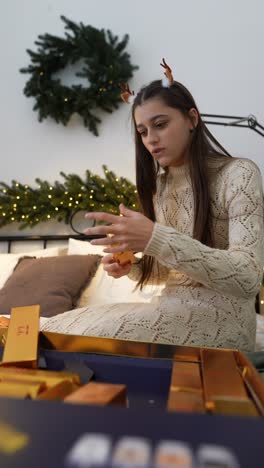 girl opening an advent calendar on christmas