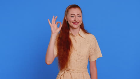 woman looking approvingly showing ok approve feedback gesture like sign positive something good