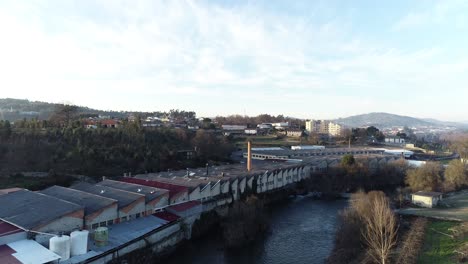 Aerial-View-of-factory-next-to-the-river