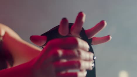 close up of an unrecognizable caucasian sportswoman  wrapping hands with boxing bandages at gym