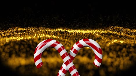 animation of christmas candies on black and golden glitter background