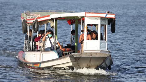 passengers enjoying a boat trip on a sunny day