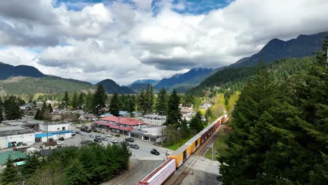 Container-Trains-Moving-On-Railroad-Tracks-In-The-Town-Of-Hope-In-British-Columbia,-Canada
