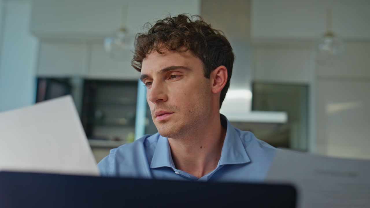 Overloaded accountant working papers sitting workplace with laptop closeup