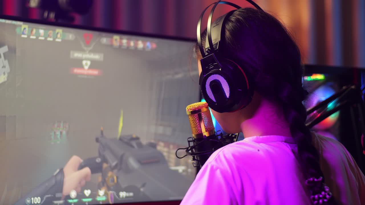 Close Up Back View Of Asian Girl Streamer Screaming Goal And Dancing Celebrating Winning Game Over Network On Personal Computer.  Live Stream Video Game, Desk Illuminated By Rgb Led Strip Light