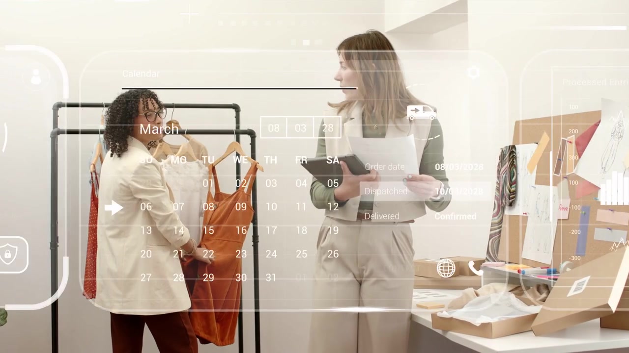Two fashion staff lifting orange dress and using tablet while HUD map charts confirming shipping