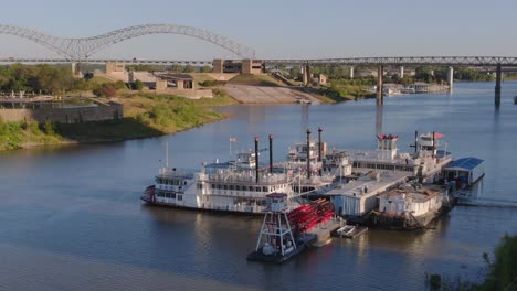 paddle-boats-docked-with-bridges-in-the-background--low-altitude-aerial-view