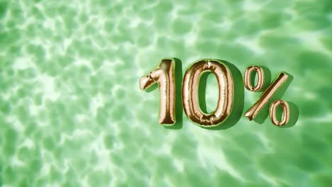 goldene 10% schwimmen über wasserwellen auf grünem hintergrund