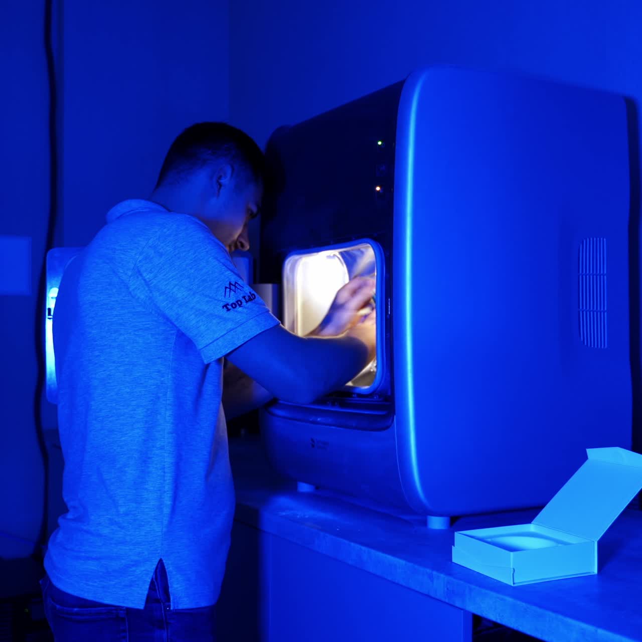 Manufacture of dentures at dental lab. Making of artificial teeth by dental technician in the clinic