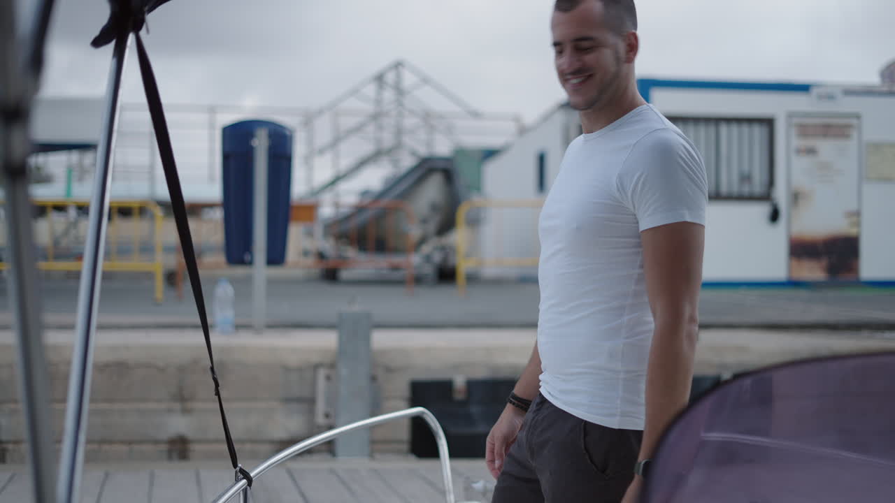 Man securing a boat at the marina