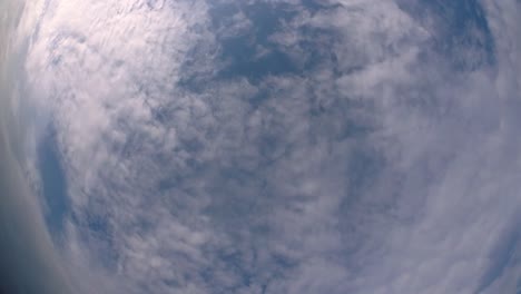 Blue-sky-and-layer-of-clouds-moving-about-in-a-fine-sunny-afternoon