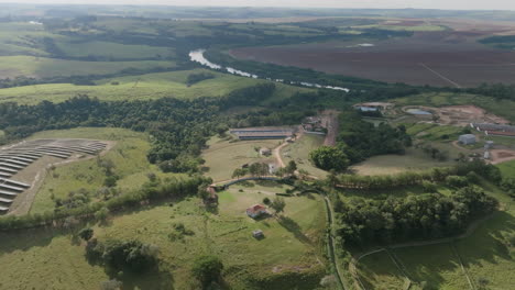 Fast-aerial-flyover-of-a-farm-and-solar-panel-array-in-the-countryside-in-Brazil