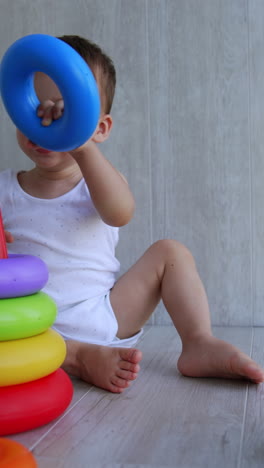 baby playing with stacking rings