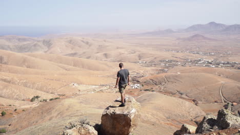 feeling airless standing on the edge of fuerteventura cliff spain