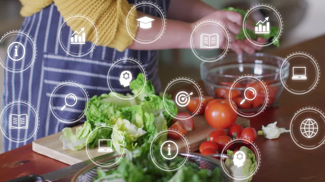 Cook entering tearing lettuce and moving to colander,tomatoes, overlay icons appearing for food