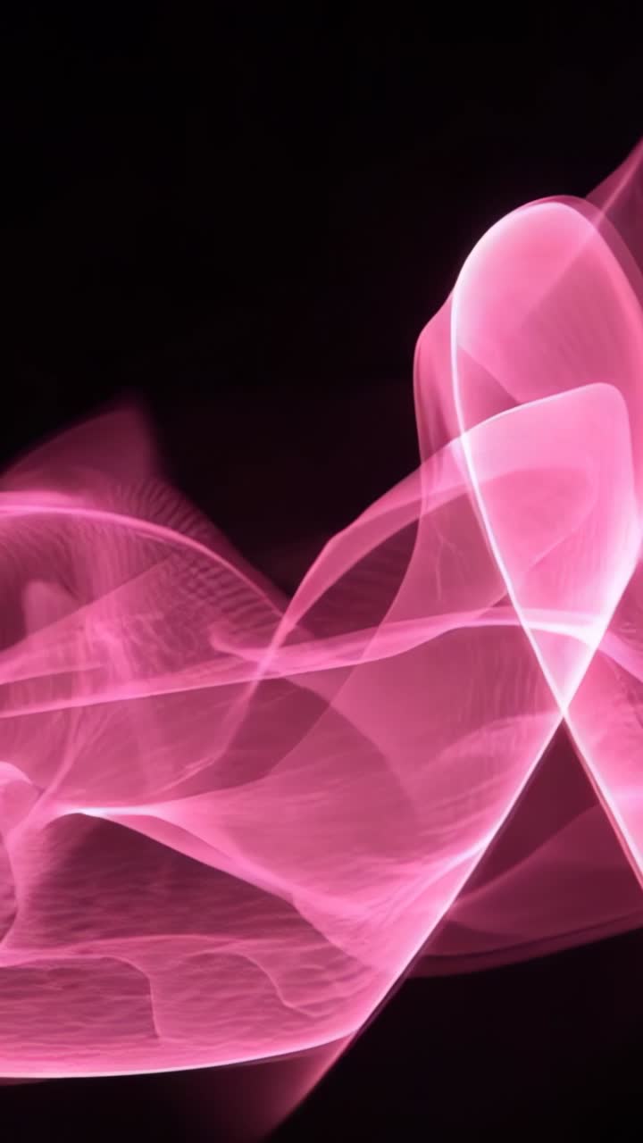 Vertical video: Appearing and unfurling pink ribbon across black void, forming peaks and troughs