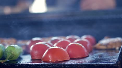 grilled tomatoes on a hotplate