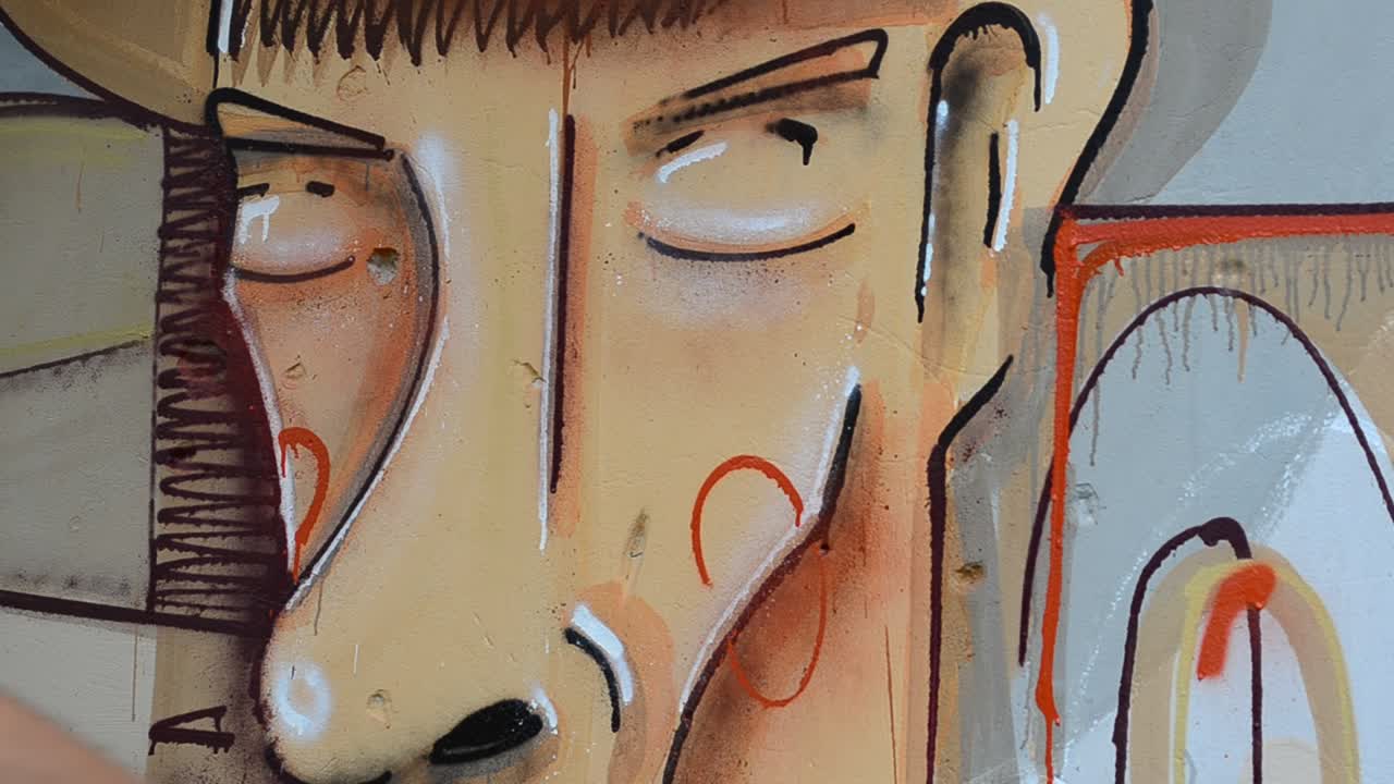 Kunstneren tegner graffiti, billede af personen med en pibe.