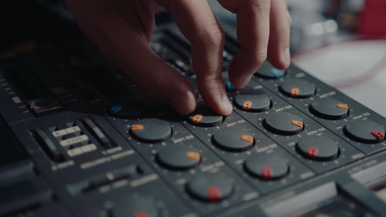 Hands of Man Creating Music with Retro Multitrack Cassette Recorder