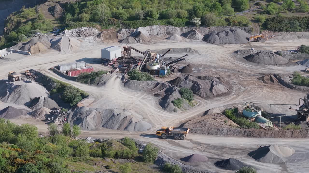 Quarry - Heavy Machinery, Dump Trucks, And Crusher At Open-pit Mine. - aerial shot