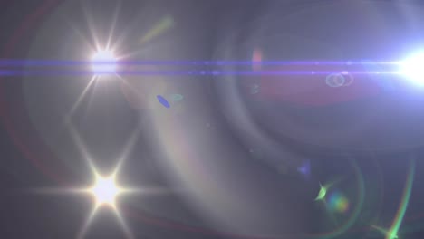 animation of spotlight with lens flare and light beams moving over dark background