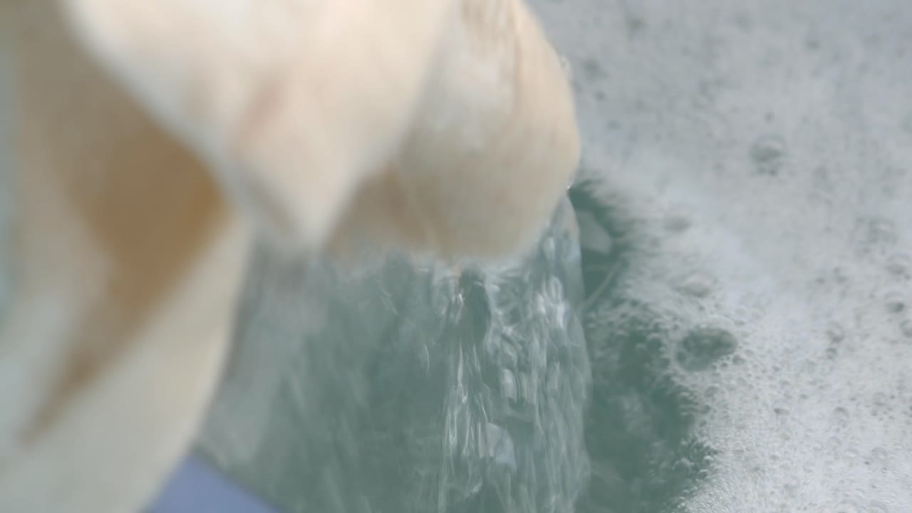 Washing water with foam