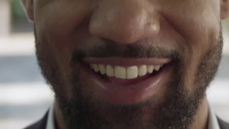 Cropped-shot-of-male-bearded-face-with-toothy-smile.
