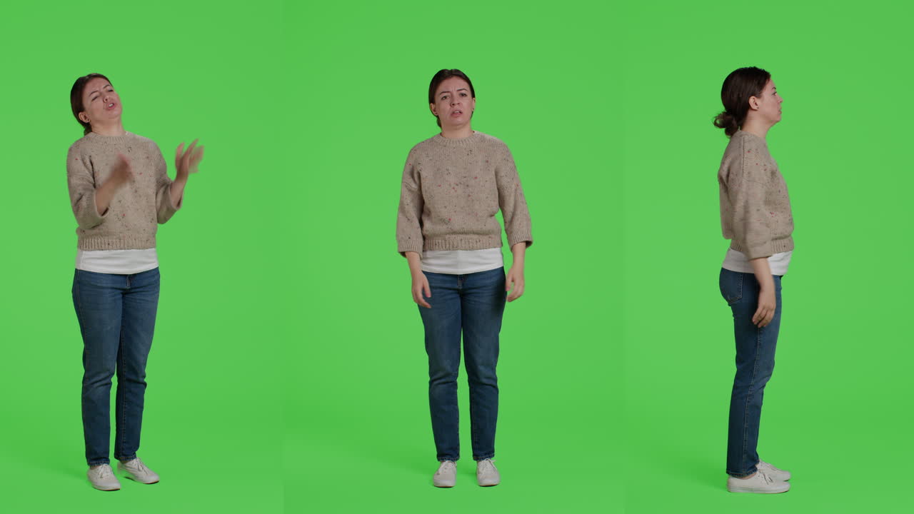 Woman performing arm gestures in front of green screen