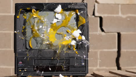 eggs thrown at old tv