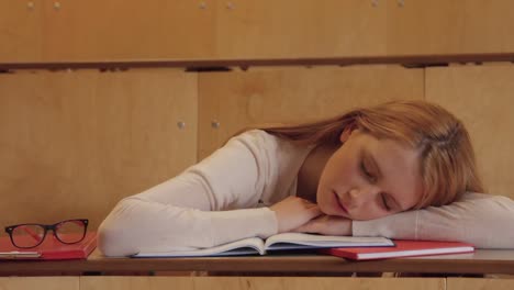 student asleep sitting in class