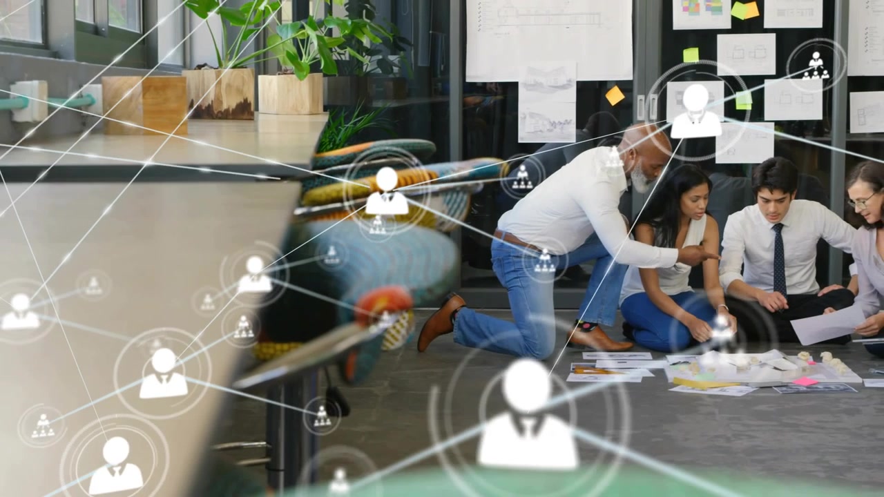Icon appearing, lead pointing, team sorting prints on laptop, nodes linking business planning