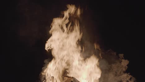 the campfire burned brightly in the night