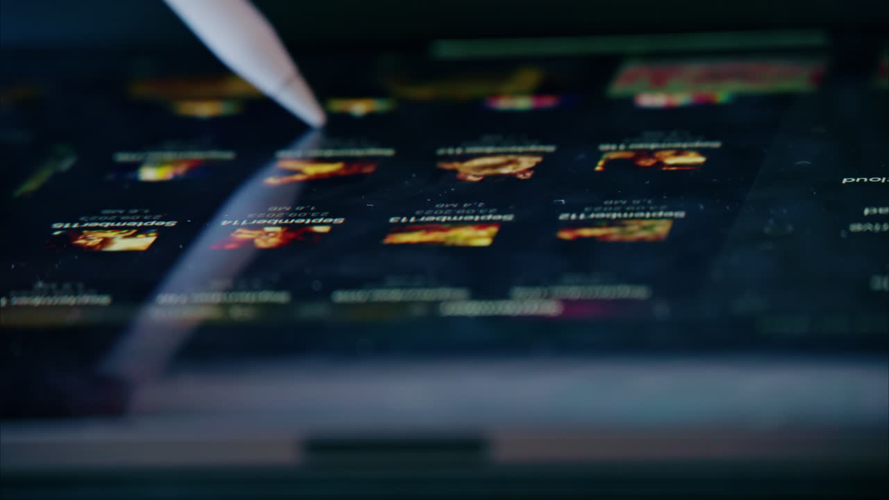 Woman working on tablet pc with pen close up