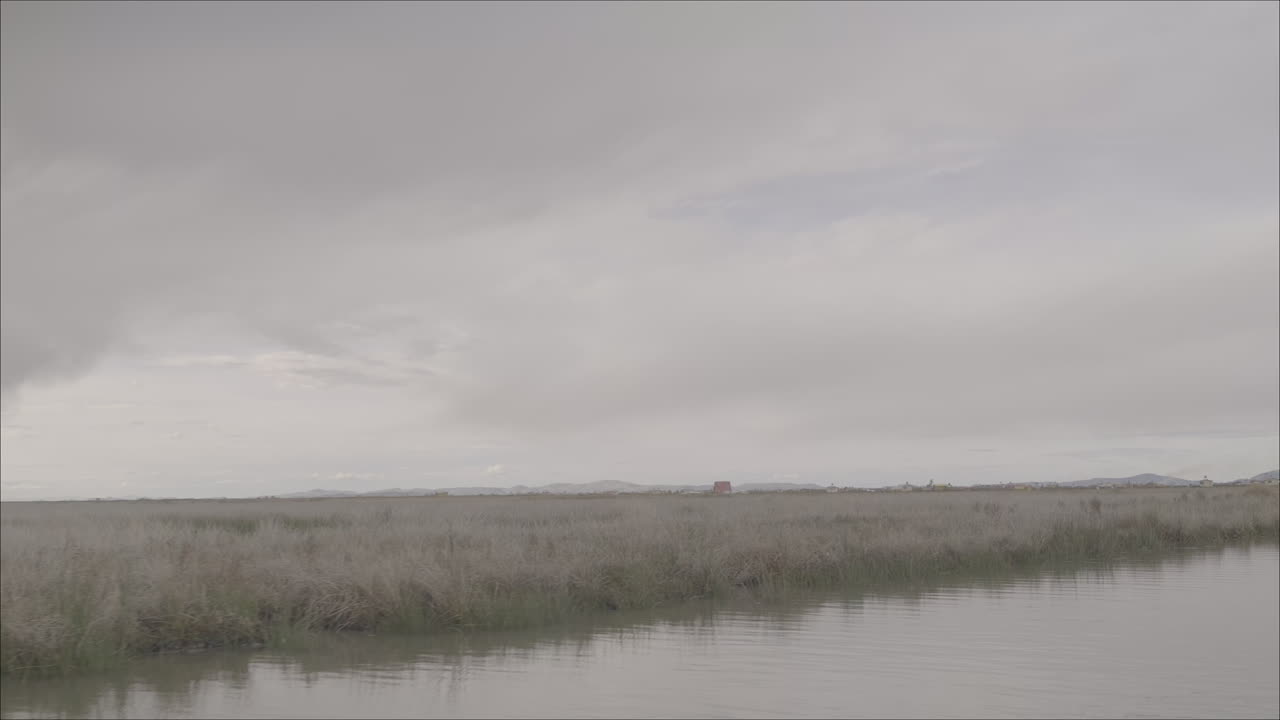 Overview shot of Lake Titicaca Bolivia on a grey day LOG