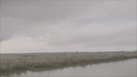 overview shot of lake titicaca bolivia on a grey day log