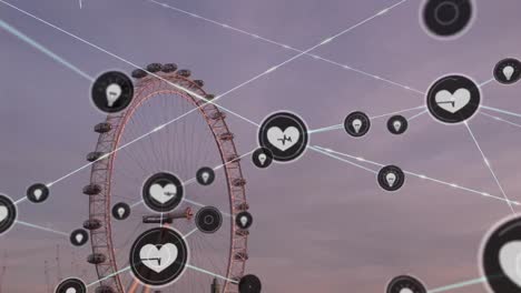 animation of network of digital icons against aerial view of london eye