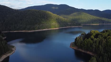 beautiful aerial shot of lake vidraru and fagaras mountains in romania