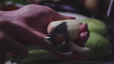 Women's-hands-wash,-peel-and-cut-vegetables-into-vegetable-stew