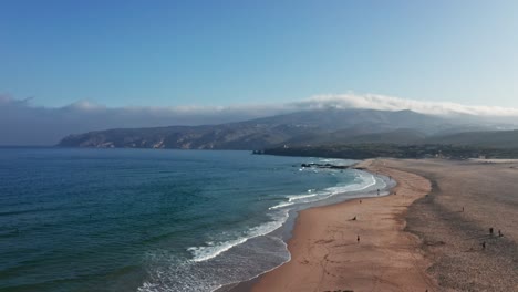 drone flying over do guincho beach in portugal