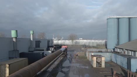 Industrial-Warehouse-With-Truck-Carrying-Long-And-Heavy-Steel-Pipes