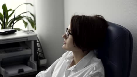 woman sitting in office chair